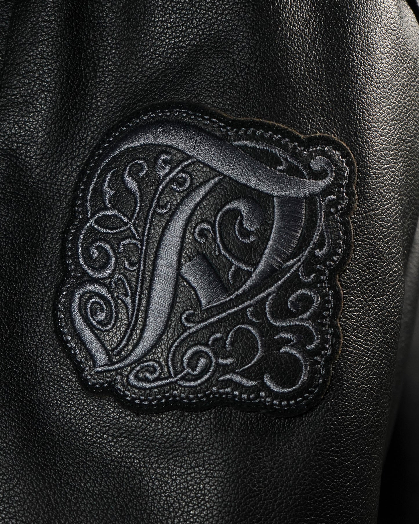 "Ten Years" Leather Varsity